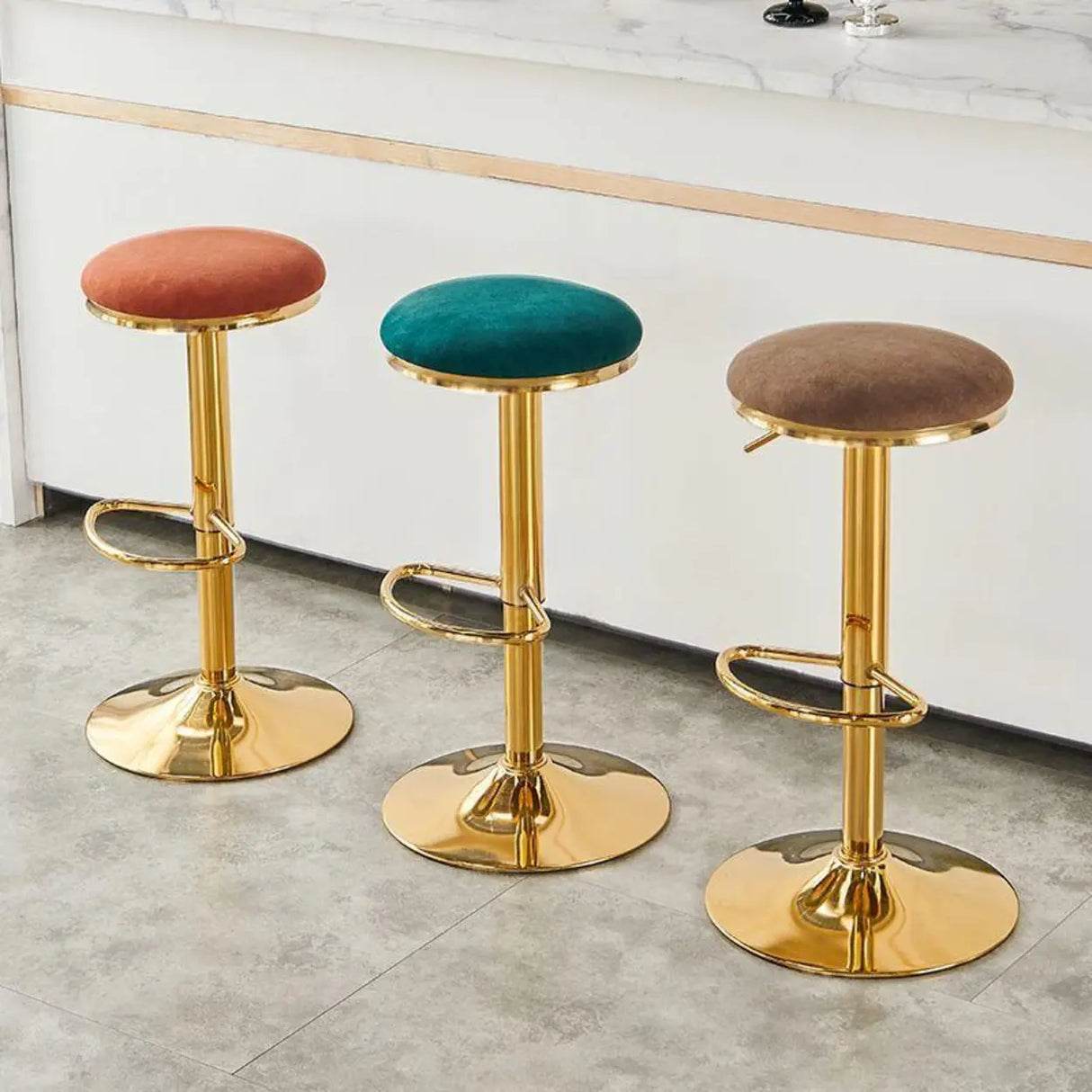 Backless Round Upholstered Gold Metal Base Bar Stool Image - 1