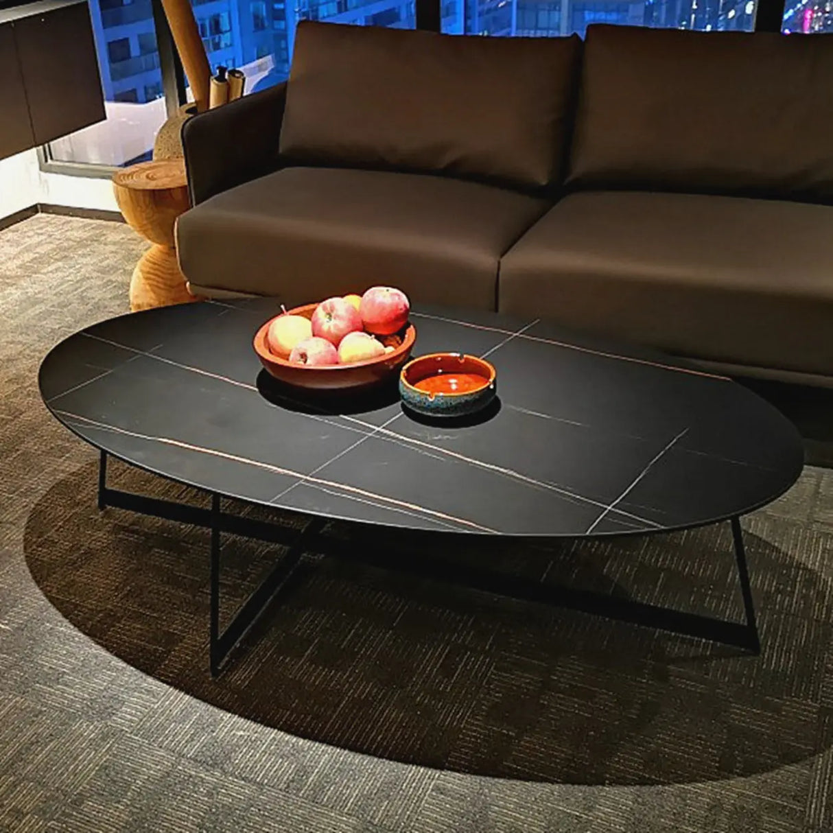 Black Oval Stone Coffee Table with Steel Cross Legs Image - 1