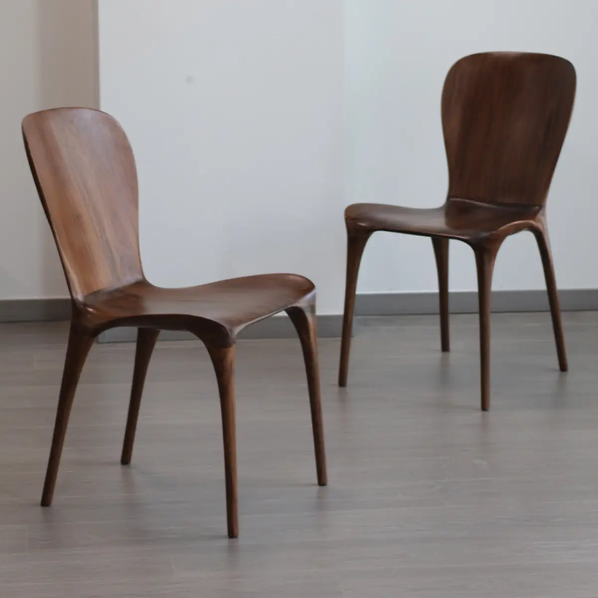 Brown Sleek Curved Back Wooden Armless Dining Chair Image - 1