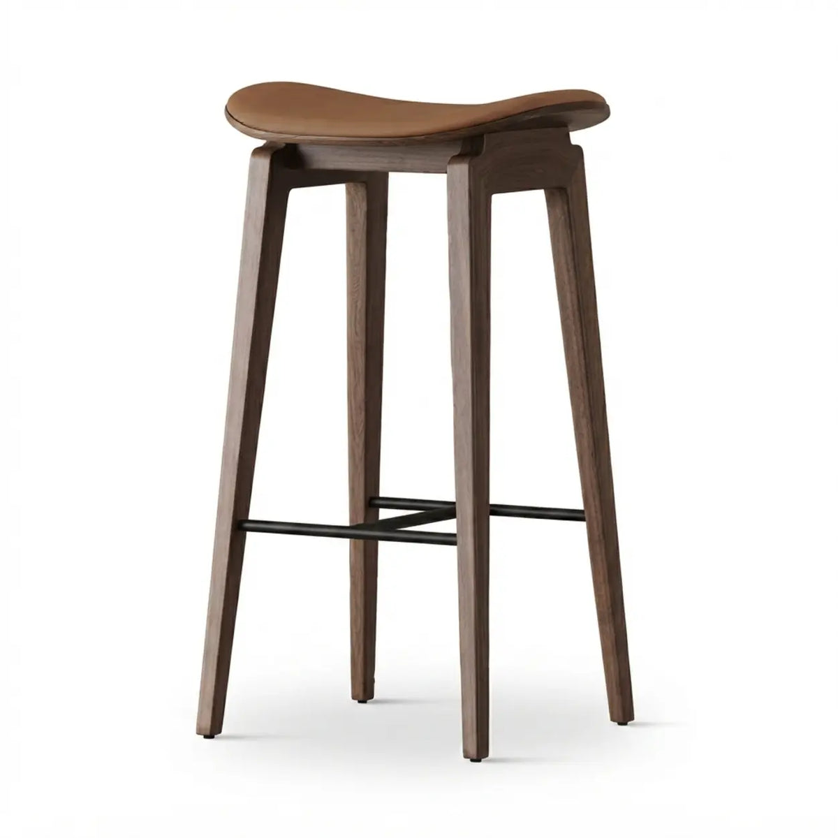 Brown faux leather counter stool with a curved saddle seat, wood frame and black metal footrest on a white background