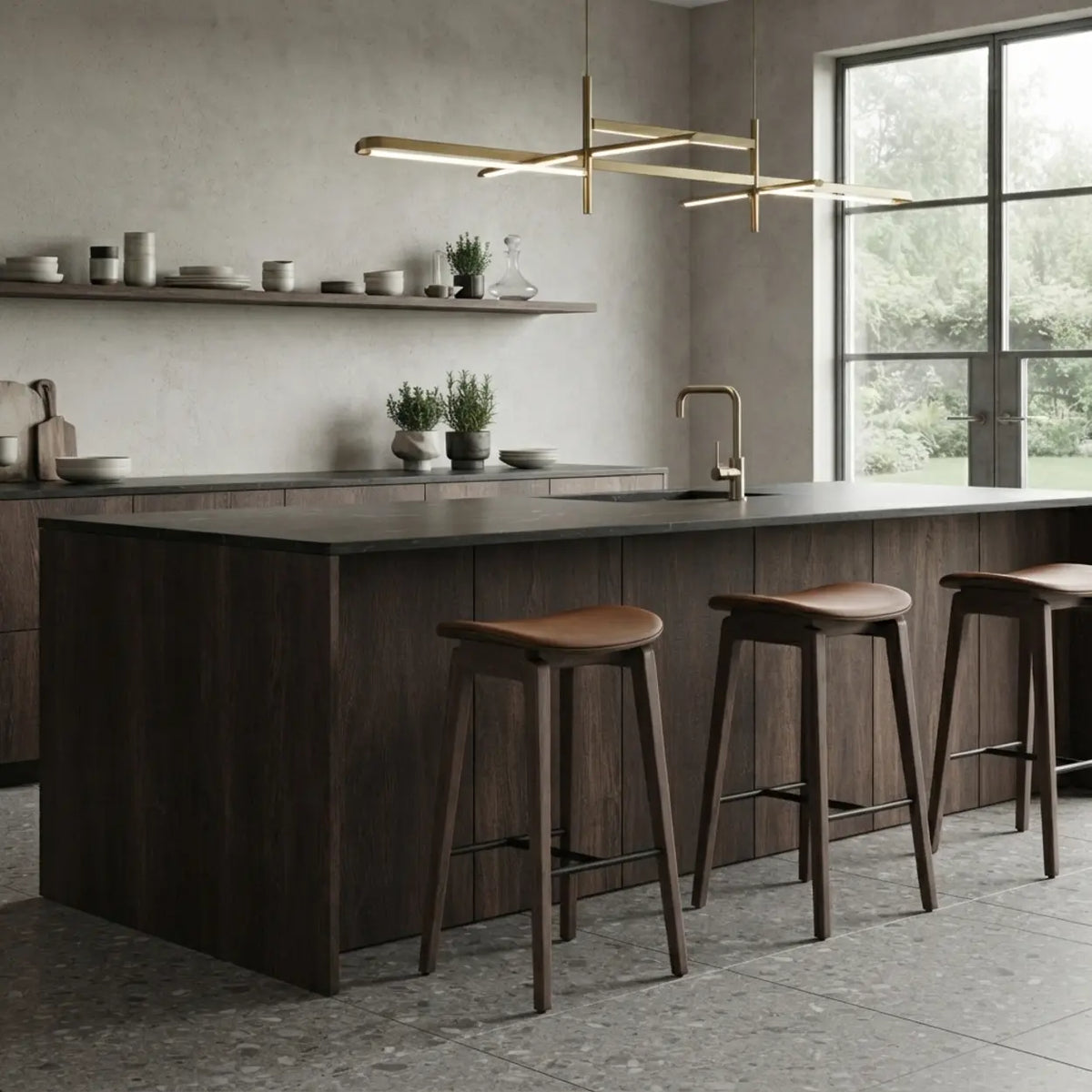 Row of coffee-brown faux leather counter stools with curved seats, wood frames and black footrests at a modern kitchen island