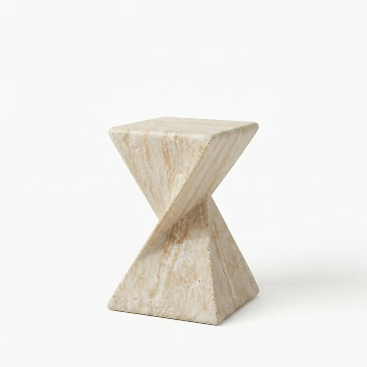 Travertine faux stone side table with a rounded square top and twisted geometric pedestal isolated on a white background