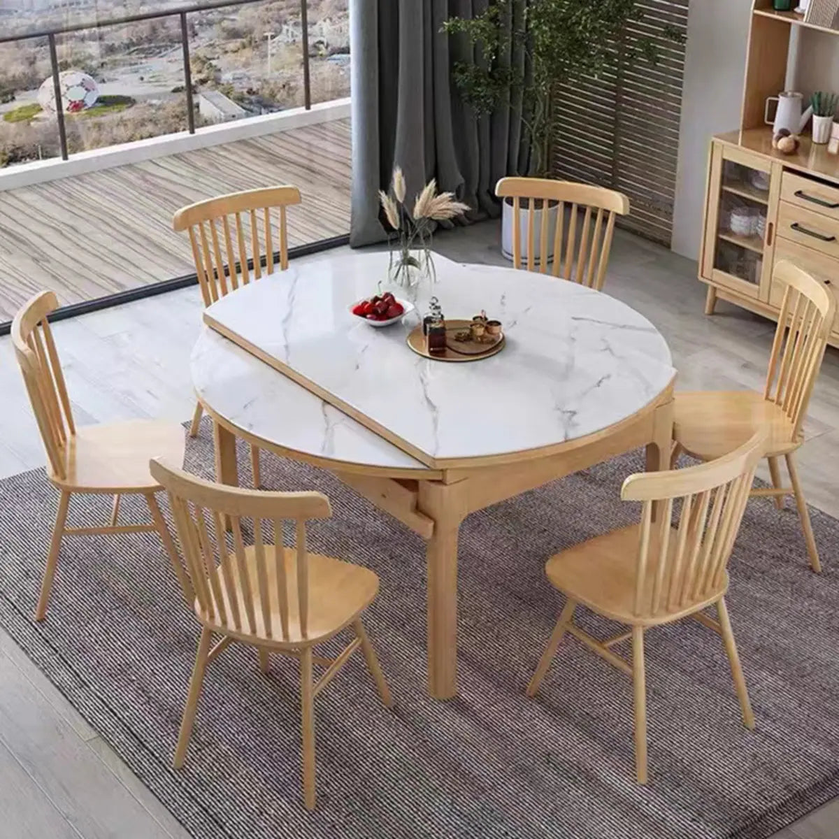 Modern Extendable Round White Sintered Stone Dining Table Image - 1