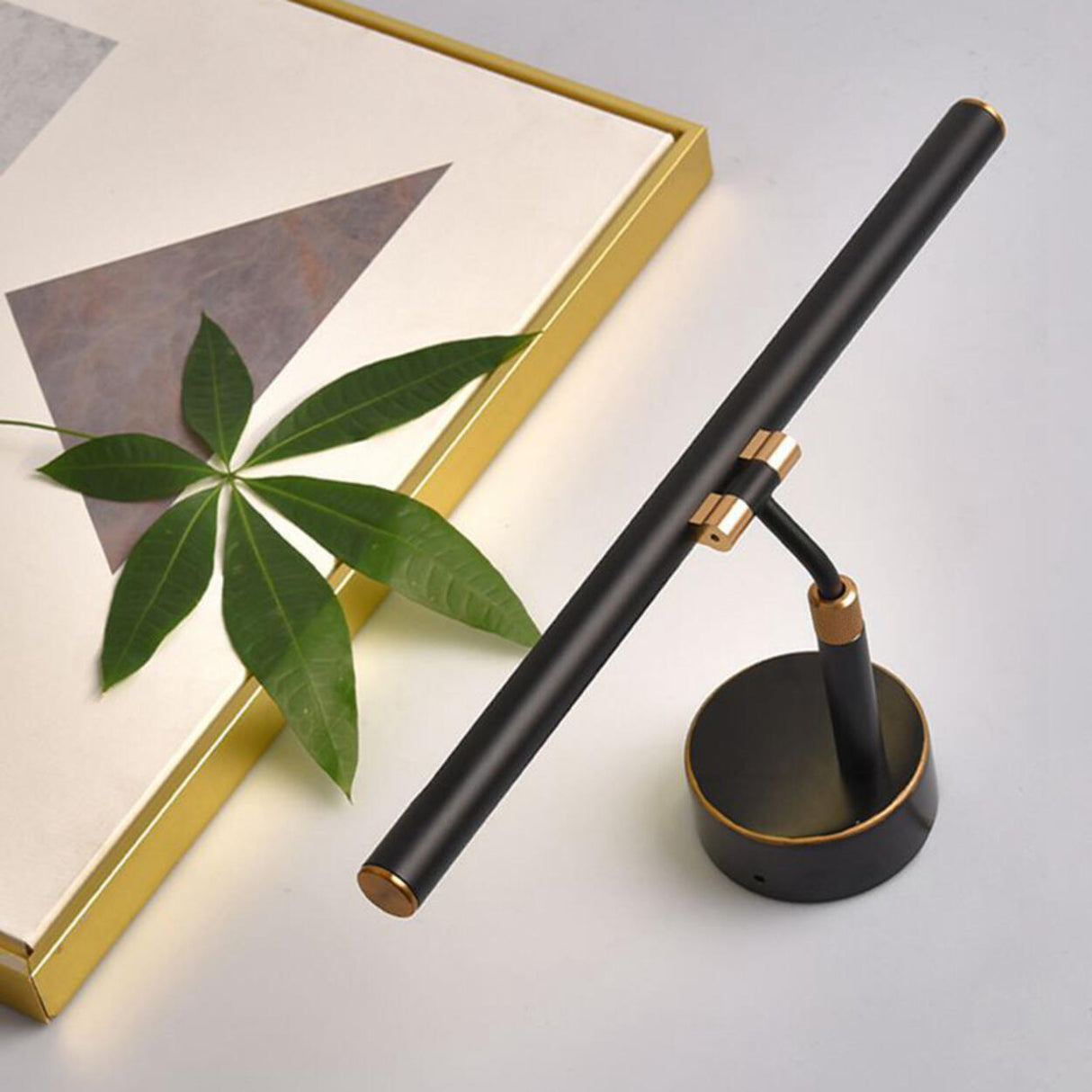 Modern Sleek Black and Gold Cylinder Vanity Light Image - 7