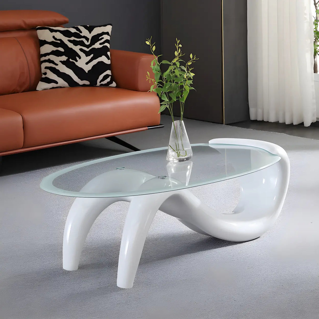 Oval Clear Glass Abstract Metal Base Coffee Table Image - 1