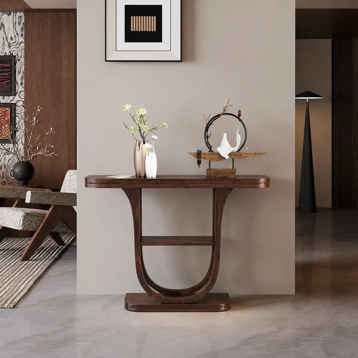 Rich brown demilune console table with shelf in an entryway, curved half-moon top styled with a vase of flowers