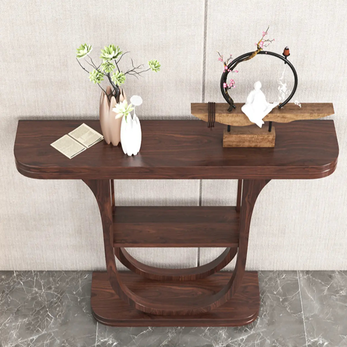 the half-moon curved tabletop and lower shelf of a rich brown wood demilune console table