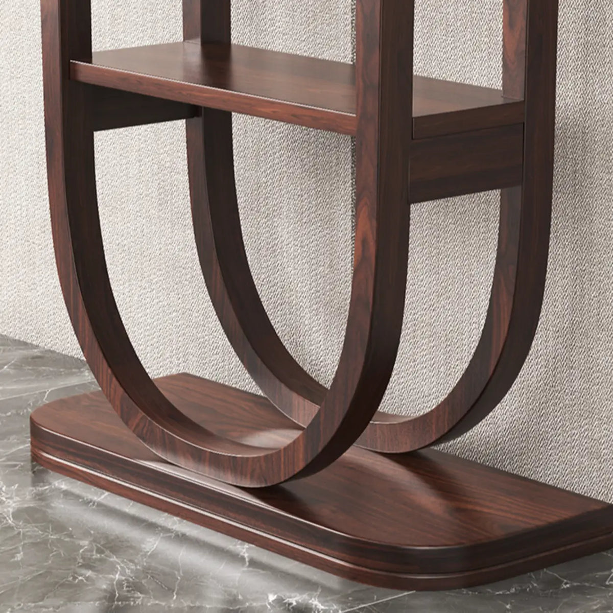 Detail of the curved U-shaped solid wood base of a rich brown demilune console table with rich grain finish