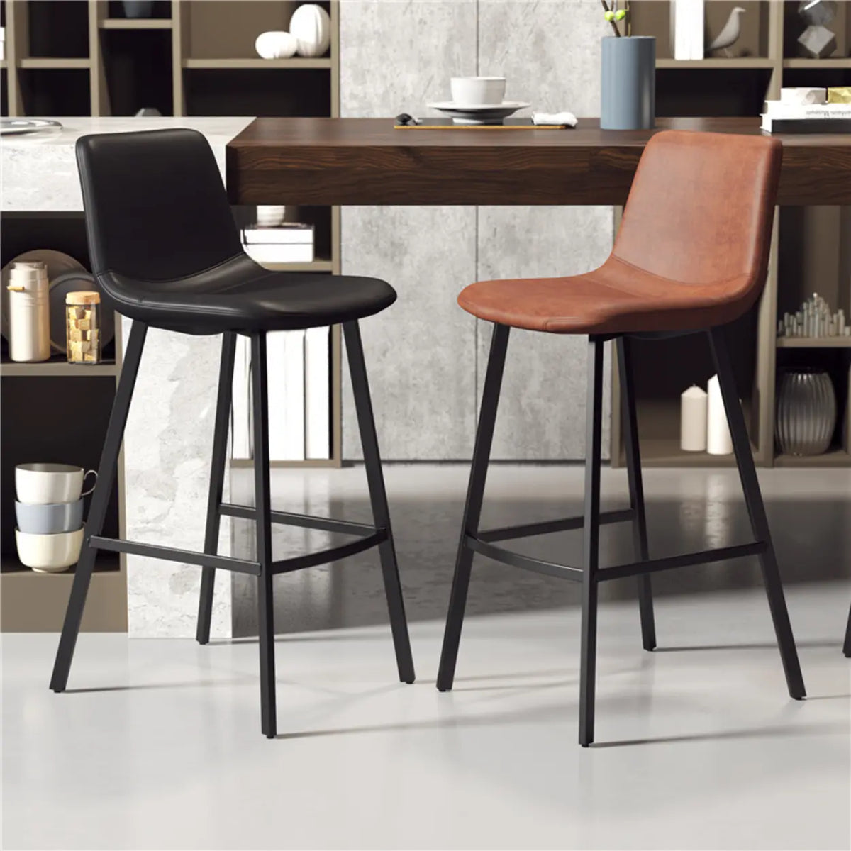 Black and brown leather saddle bar stools with low backs and footrests beside a modern breakfast bar