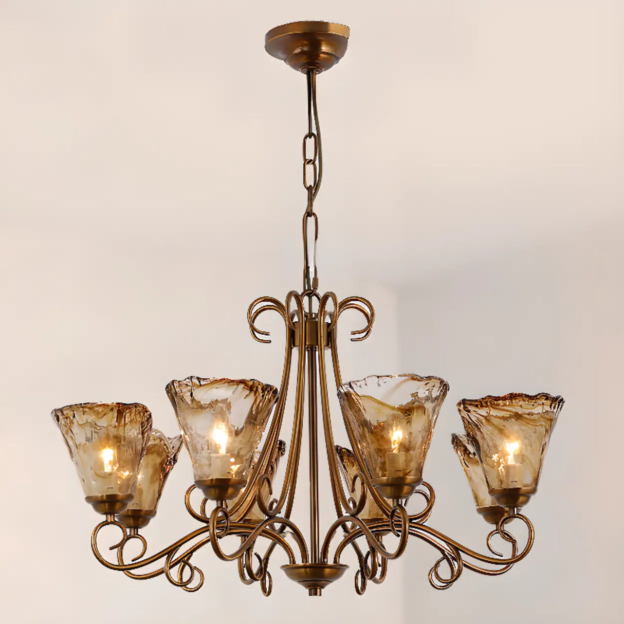 Vintage Bronze Chandelier with Amber Glass Lampshades Image - 1