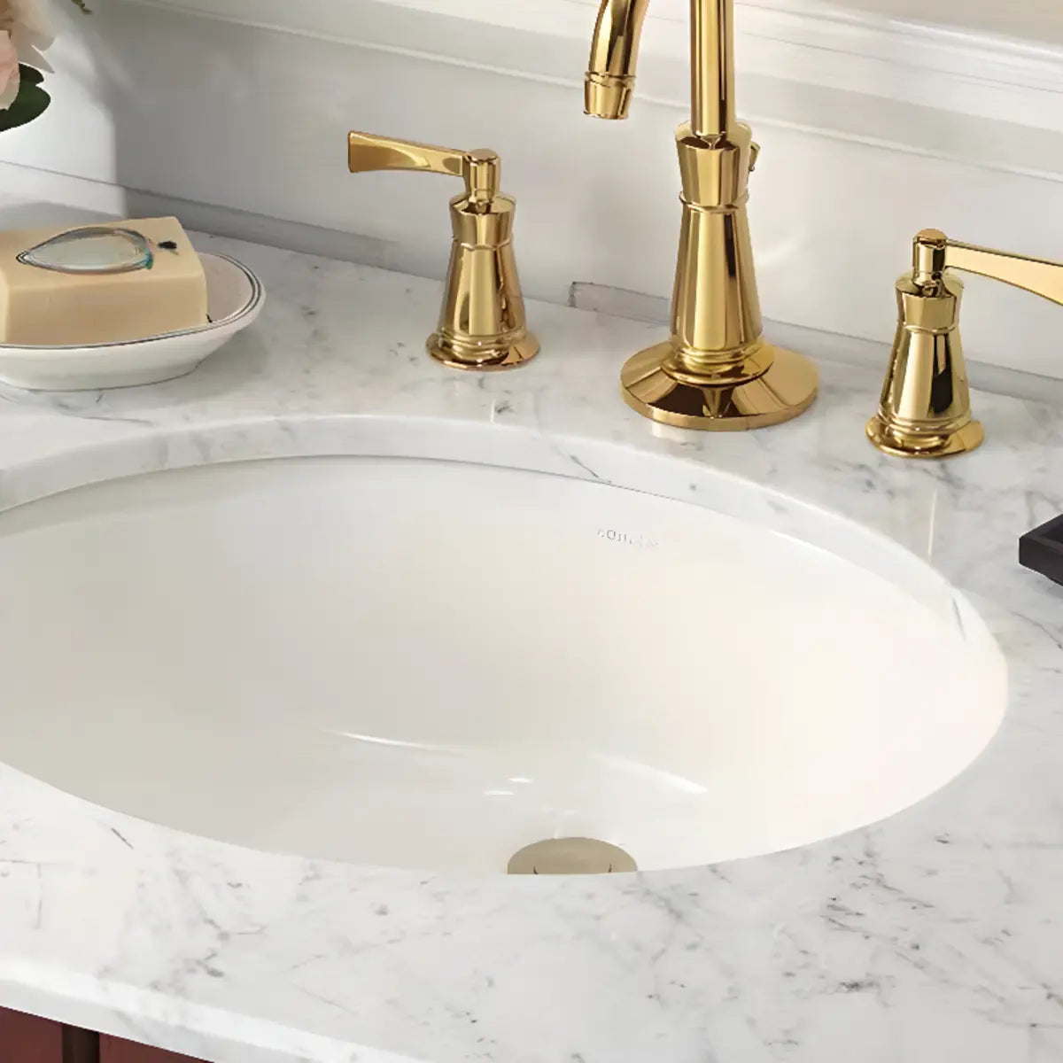 White Undermount Oval Ceramic Sink with Supply Lines Image - 1