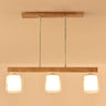 4-Light Minimalist Cylinder Wooden Island Pendant Light Image - 2