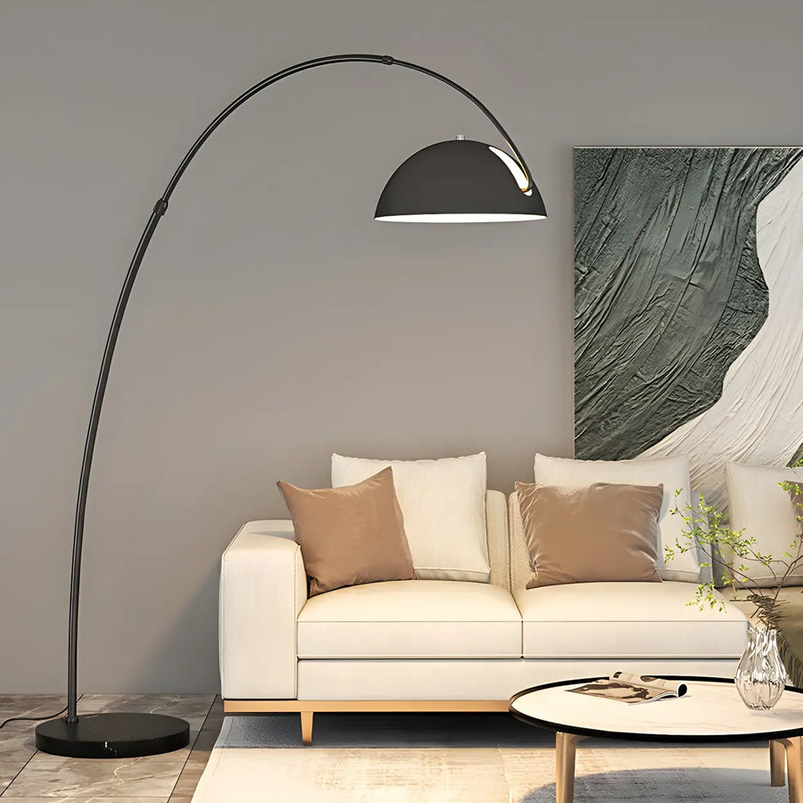 Adjustable arc floor lamp positioned beside a modern sofa