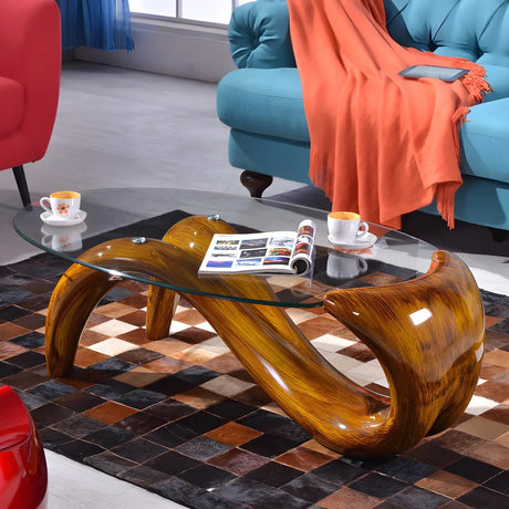 Clear Glass Oval Top Abstract Metal Base Coffee Table Image - 1