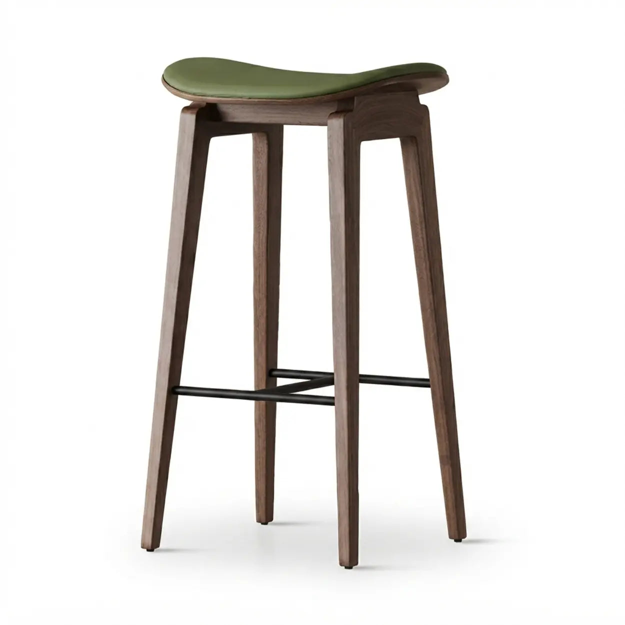 Green faux leather counter stool with a curved saddle seat, walnut wood frame and black footrest isolated on white