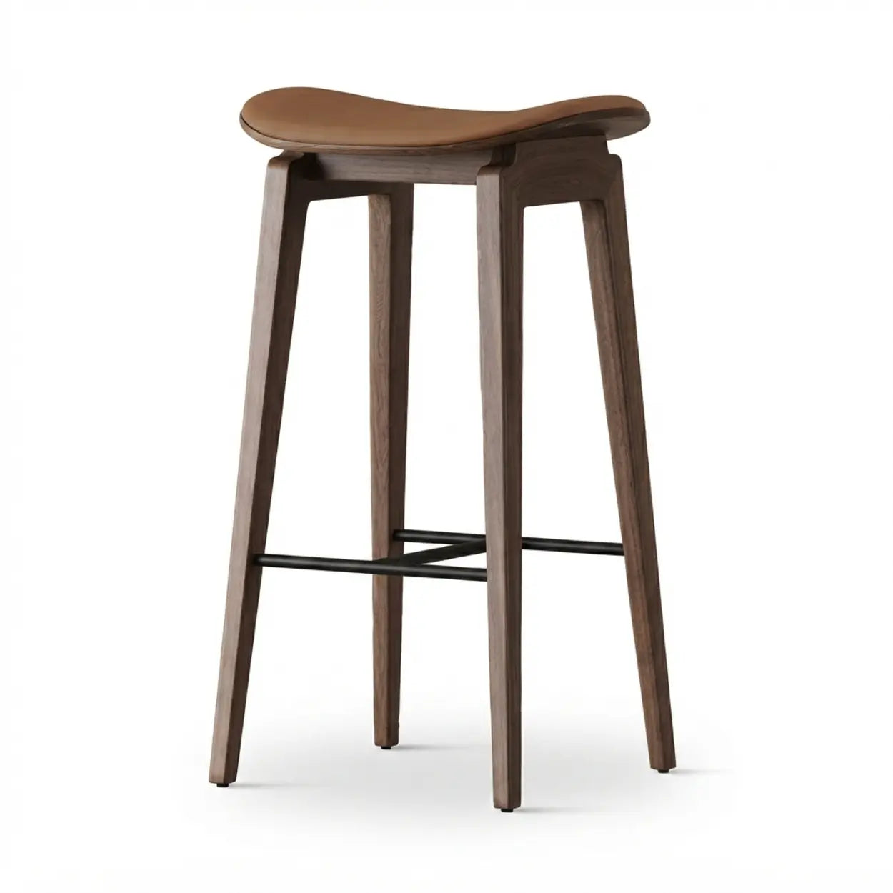 Brown faux leather counter stool with a curved saddle seat, wood frame and black metal footrest on a white background