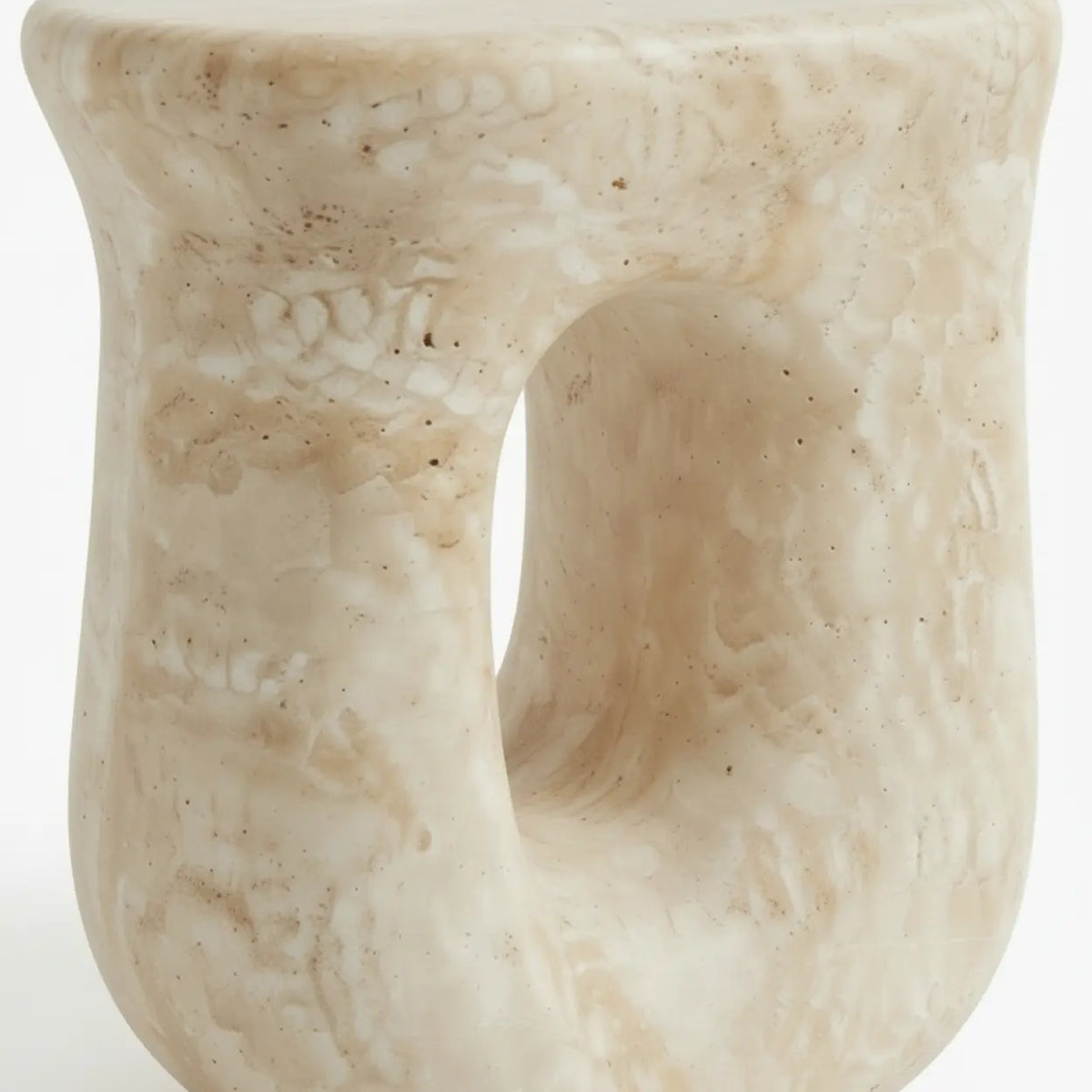 Faux travertine stone side table close-up showing the hollow curved base and detailed travertine texture