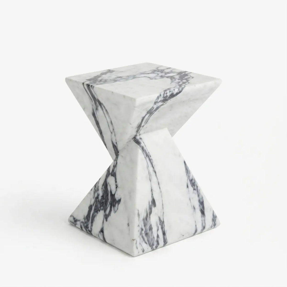 White veined faux stone side table with a twisted geometric pedestal isolated on a white background