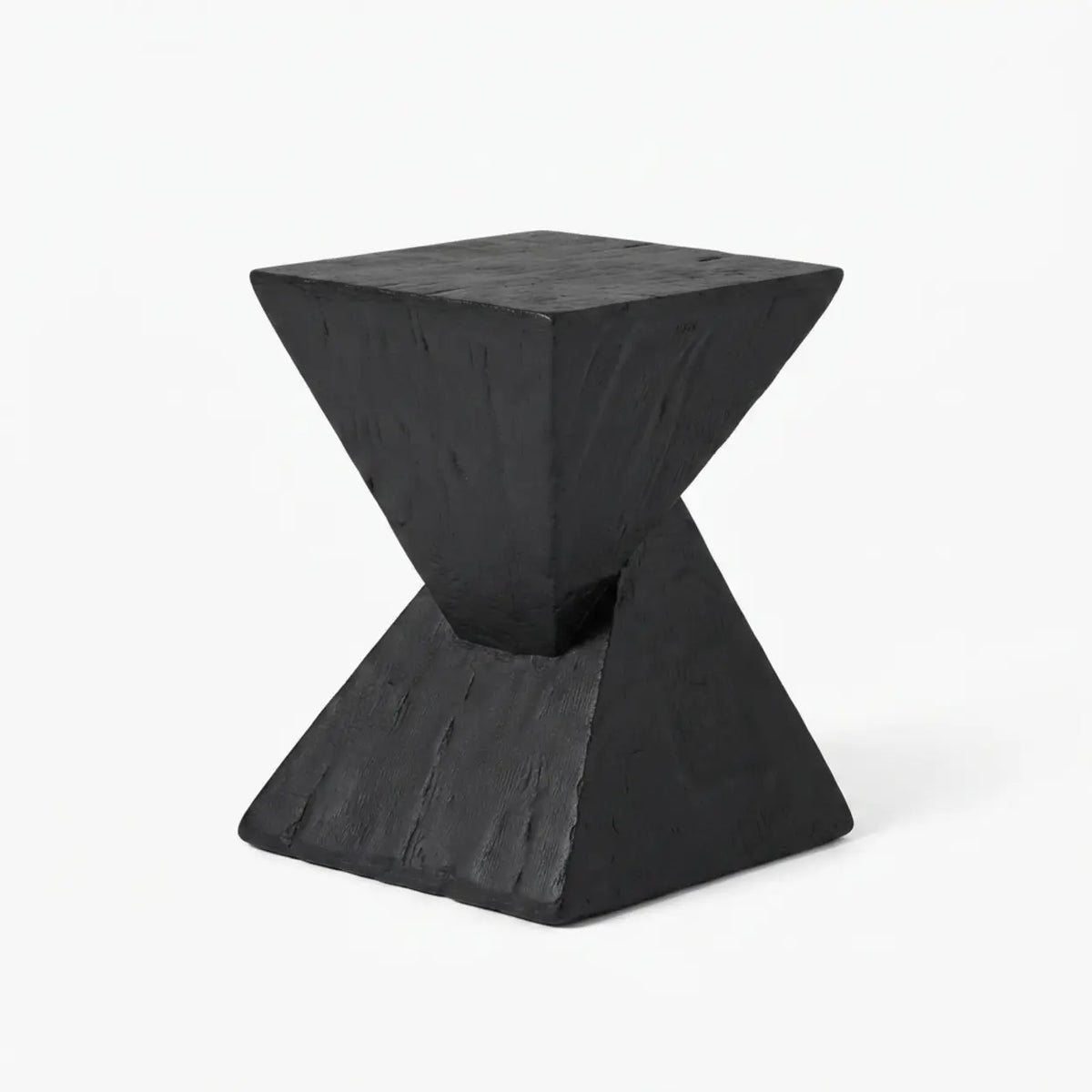Black faux travertine stone side table with a twisted geometric pedestal isolated on a white background