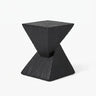 Black faux travertine stone side table with a twisted geometric pedestal isolated on a white background