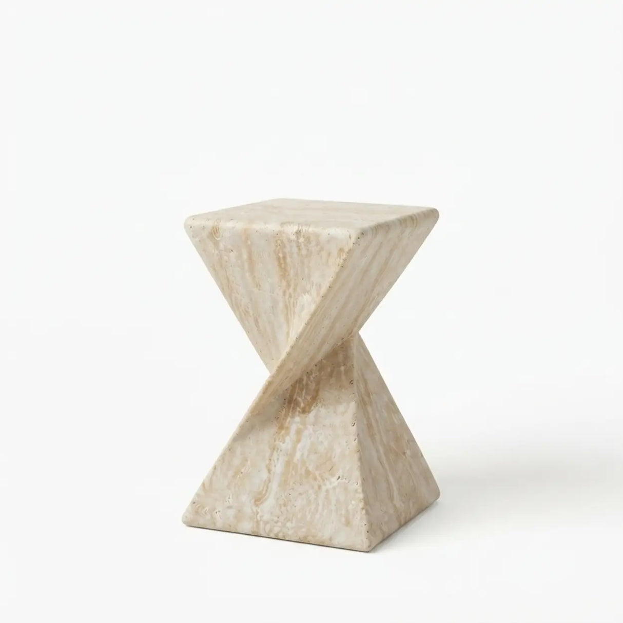 Travertine faux stone side table with a rounded square top and twisted geometric pedestal isolated on a white background
