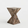 Brown veined faux stone side table with a twisted geometric pedestal isolated on a white background