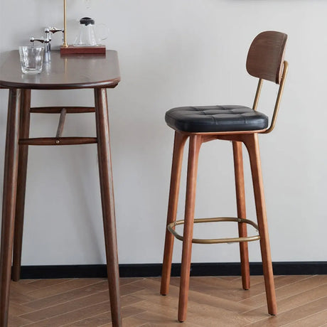 Leather Upholstered Tufted Wood Bar Stool with Metal Footrest Image - 1