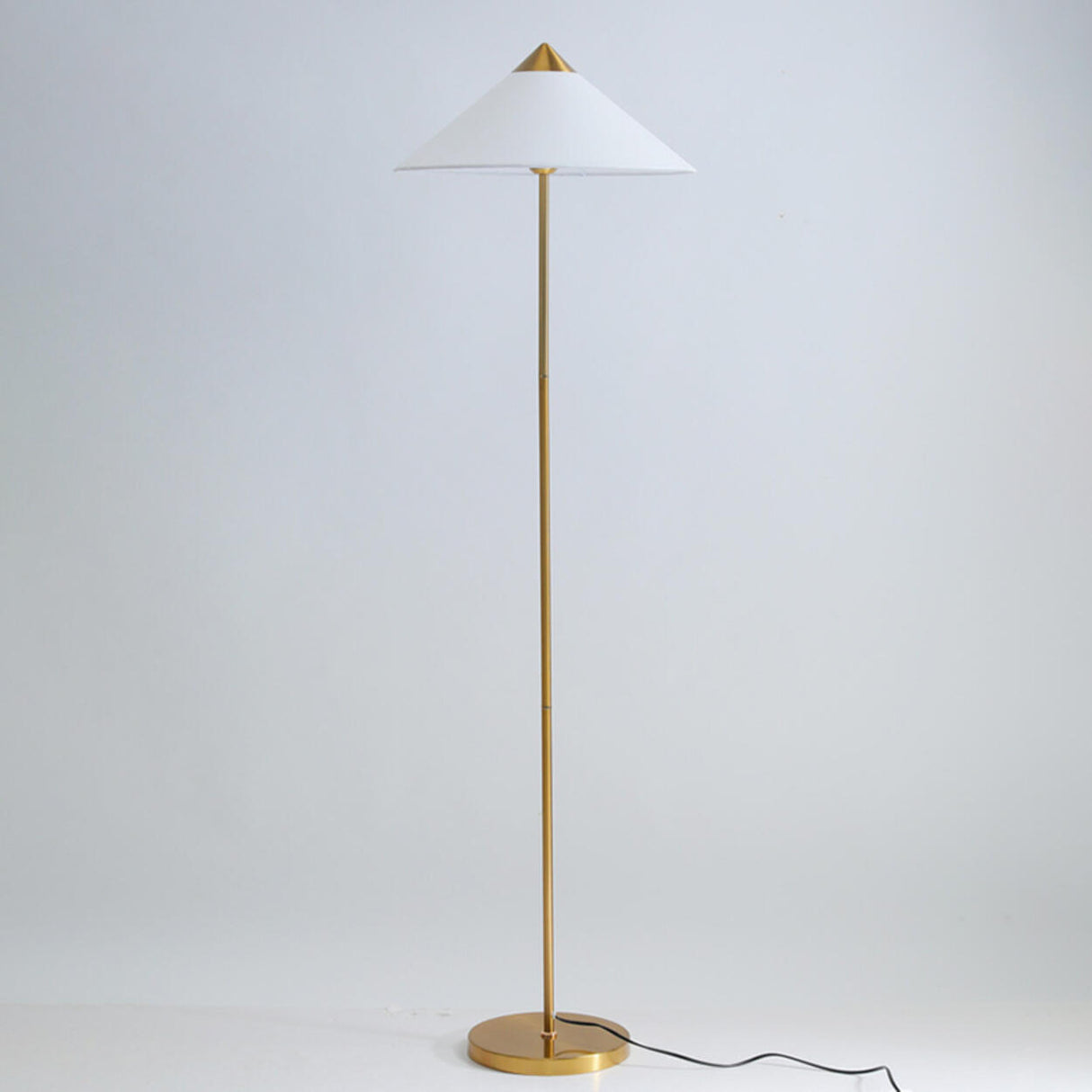 Living Room Sleek Pyramid Shade and Gold Floor Lamp Image - 10