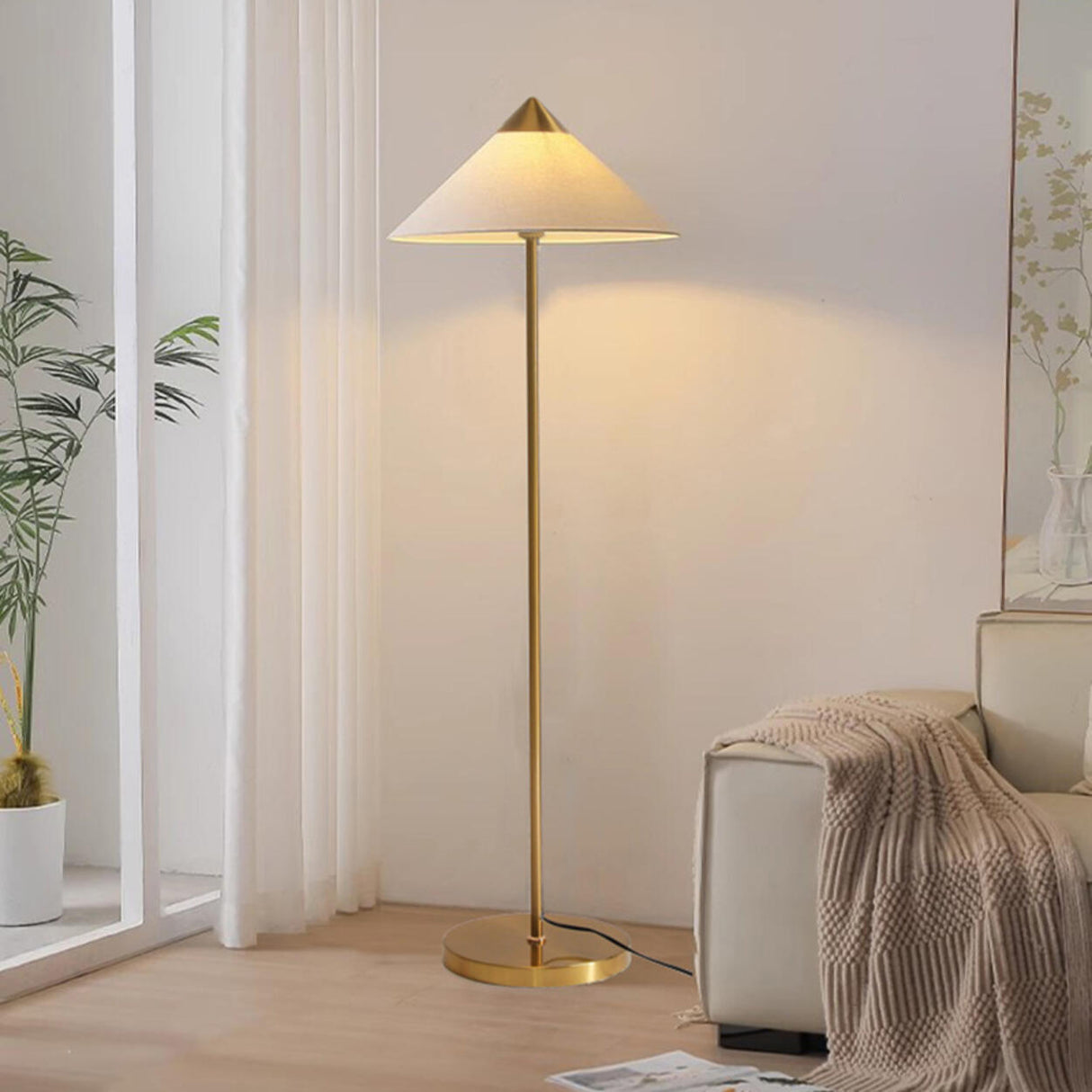 Living Room Sleek Pyramid Shade and Gold Floor Lamp Image - 3