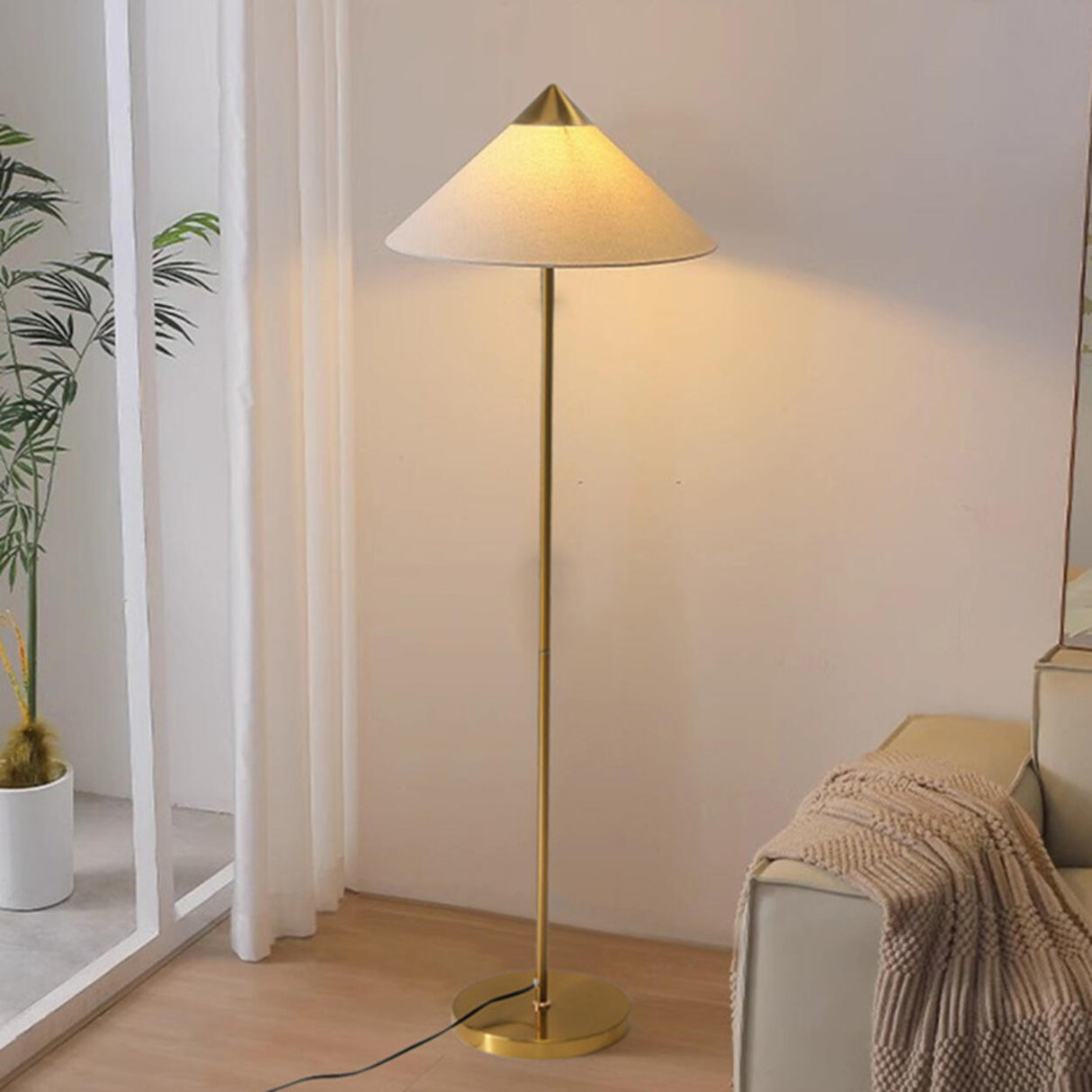 Living Room Sleek Pyramid Shade and Gold Floor Lamp Image - 4