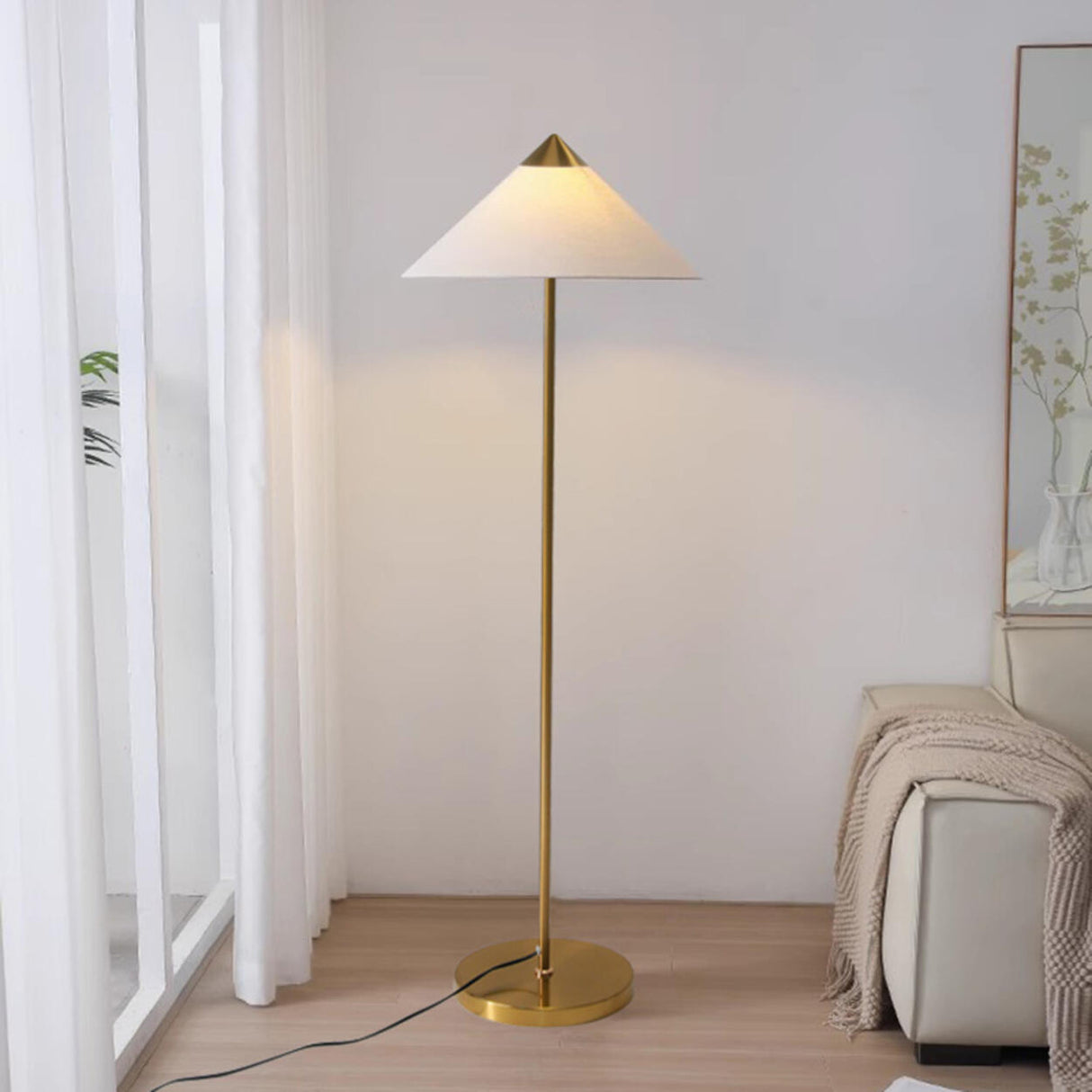 Living Room Sleek Pyramid Shade and Gold Floor Lamp Image - 5