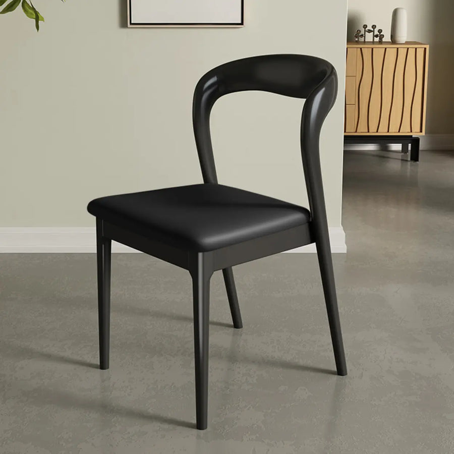 Mid-century modern wood open-back upholstered armless dining chair for a round dining table