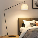 Minimalist Drum Shade and Black Arc Metal Floor Lamp Image - 9