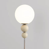 Minimalist Stacked Green Accents and Globe Floor Lamp Image - 10