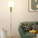 Minimalist Stacked Green Accents and Globe Floor Lamp Image - 14