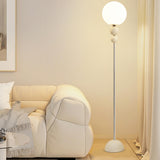 Minimalist Stacked Green Accents and Globe Floor Lamp Image - 2