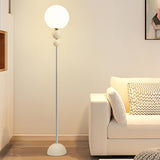 Minimalist Stacked Green Accents and Globe Floor Lamp Image - 3