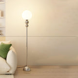 Minimalist Stacked Green Accents and Globe Floor Lamp Image - 7