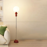 Minimalist Stacked Green Accents and Globe Floor Lamp Image - 9