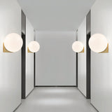 Minimalist White Glass Globe Bedroom Wall Sconce Image - 5