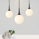 Minimalist White Globe-Shaped Glass Pendant Light Image - 3