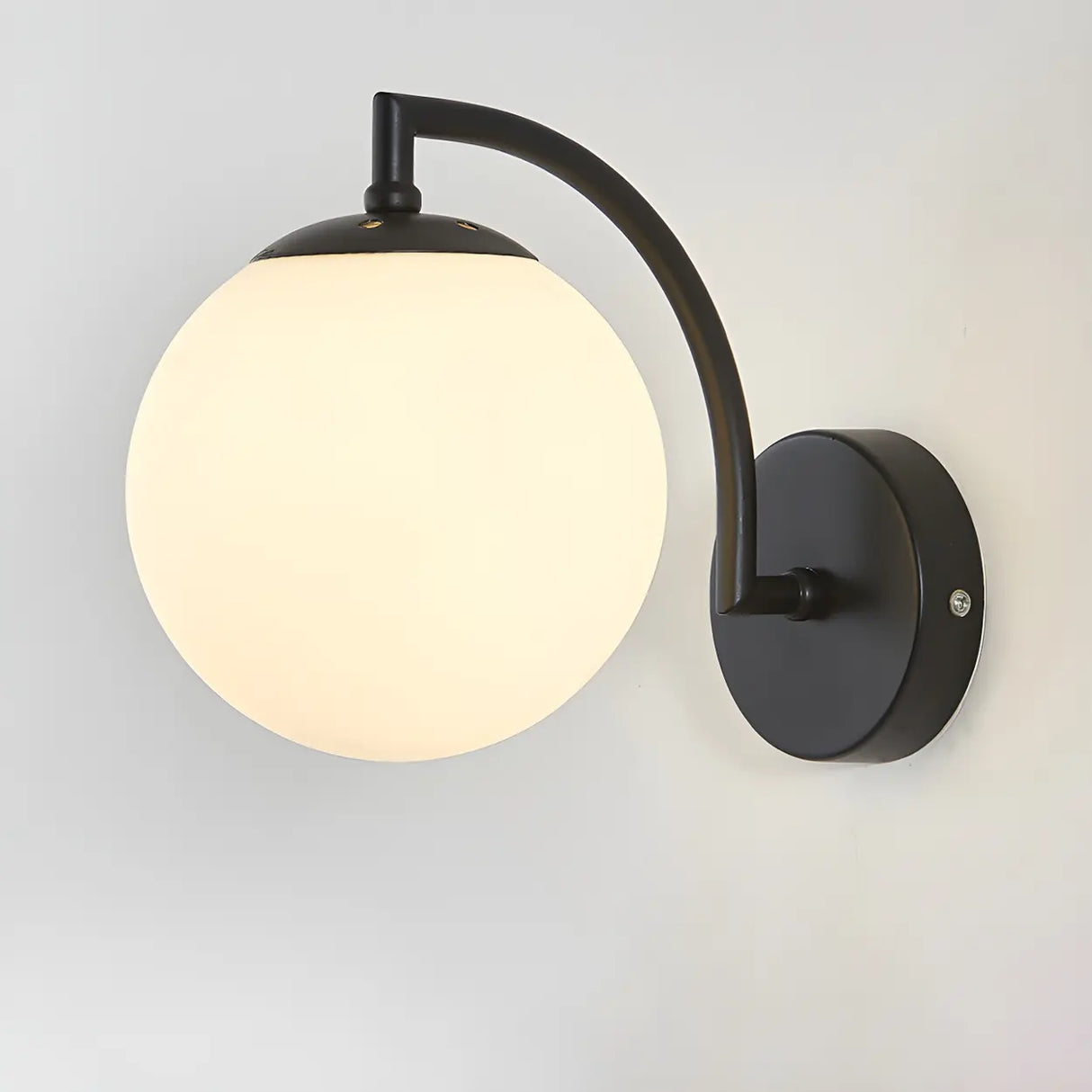 Modern Globe Glass Wall Light with Black Finish Image - 5