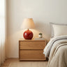 Red Red Ceramic Table Lamp with Beige Fabric Drum Shade Image - 1