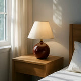 Red Ceramic Table Lamp with Beige Fabric Drum Shade Image - 2