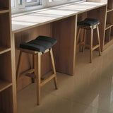 Saddle Wood Backless Short Bar Stool with Footrest Image - 1