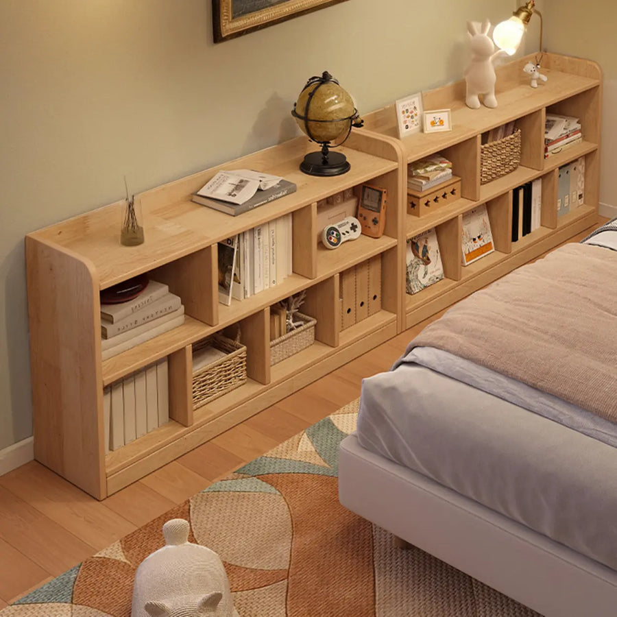 Low horizontal natural pine storage bookcase with multiple open compartments
