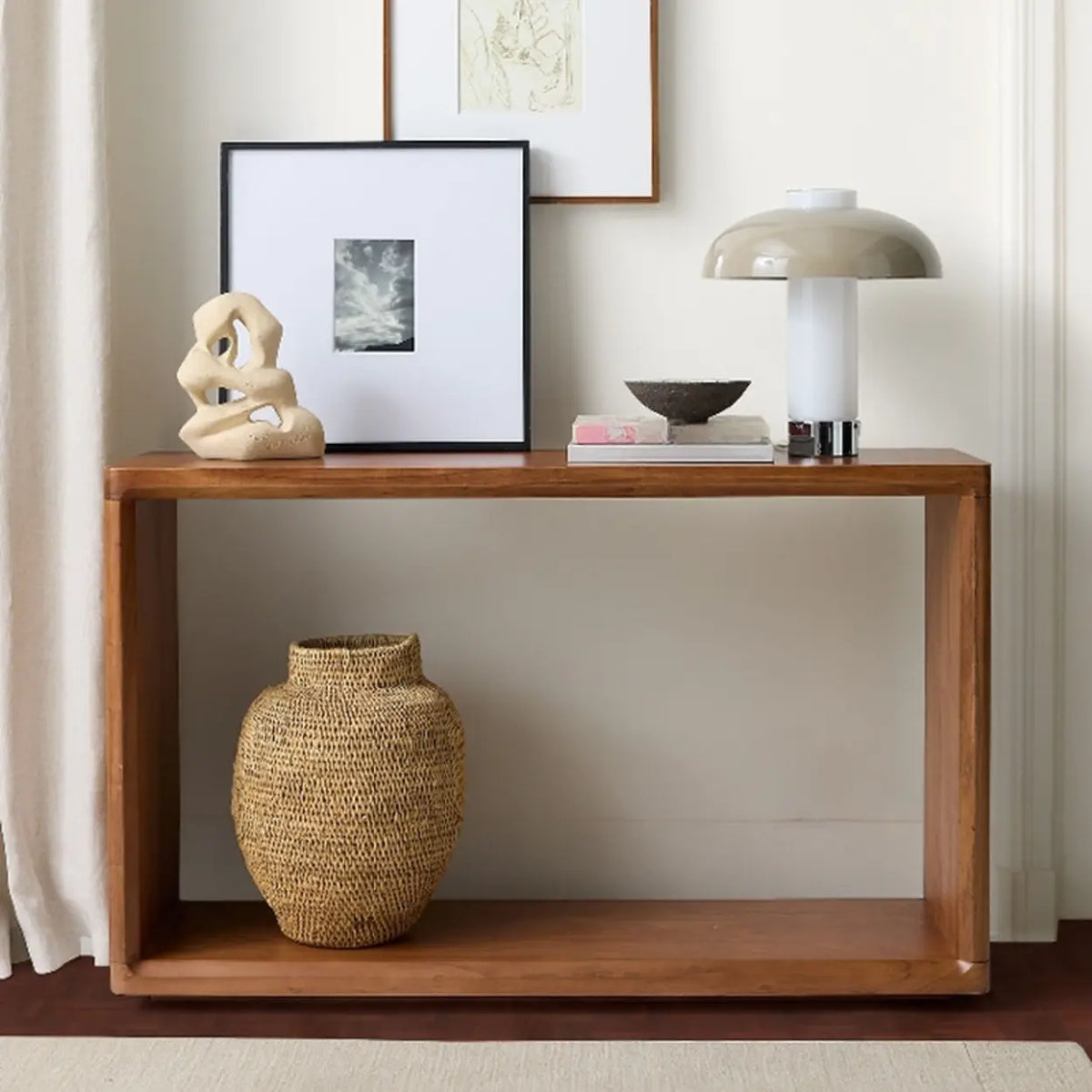 Brown wood grain console table with shelf for books plants and entryway decor