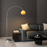Sleek Adjustable Amber Glass Globe Arched Floor Lamp Image - 1