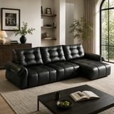 Black top-grain leather 3-seater reclining sofa with sliding chaise in a contemporary living room