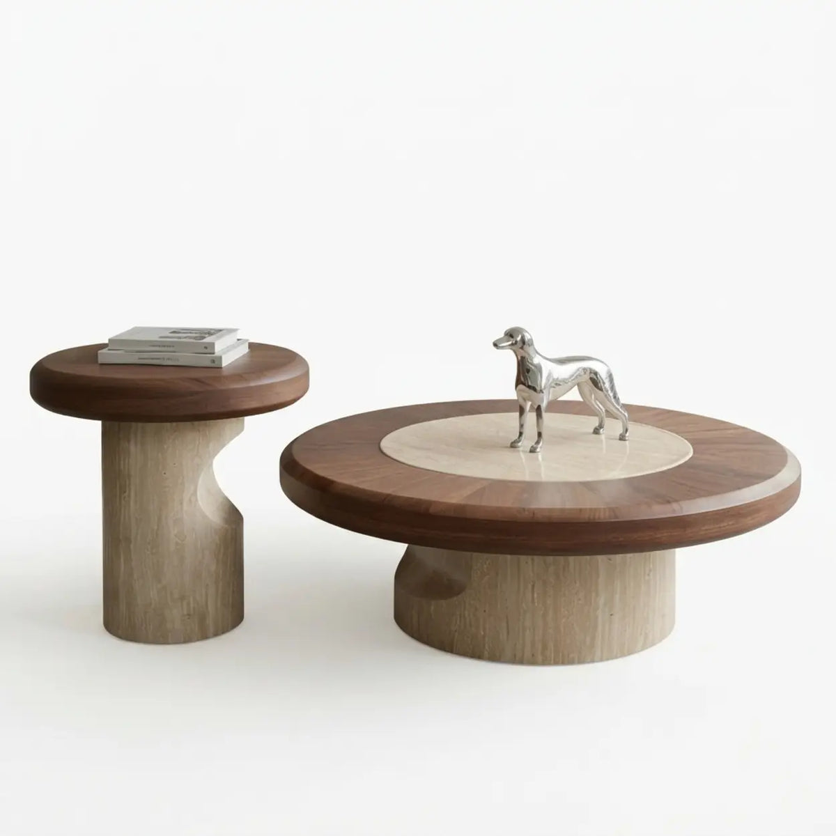 Two-piece walnut round coffee table set with wood-grain tops, cream stone inlay and sculptural stone bases isolated on white with books and a silver horse